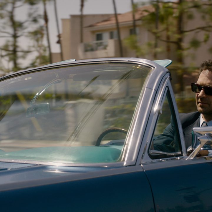 Mickey Haller drives a comfortable in a scene from The Lincoln Lawyer.