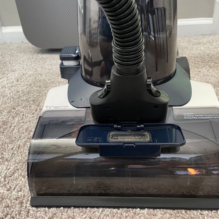 The Tineco Carpet One with hose attached.