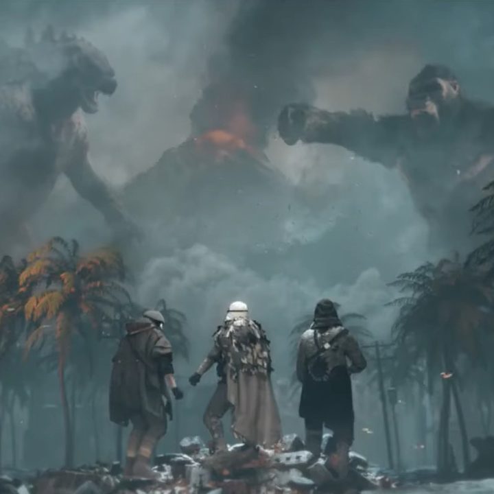 Soldiers watch Godzilla and Kong about to fight.