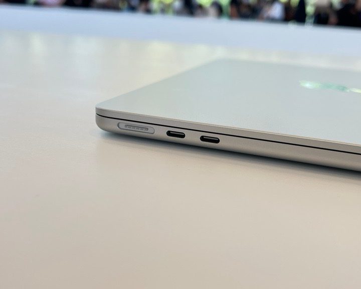 The M2 MacBook Air sitting on a desk with ports in view.