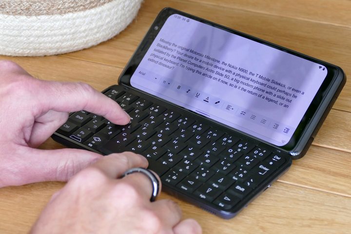 Typing on the Planet Computers Astro Slide 5G's keyboard.