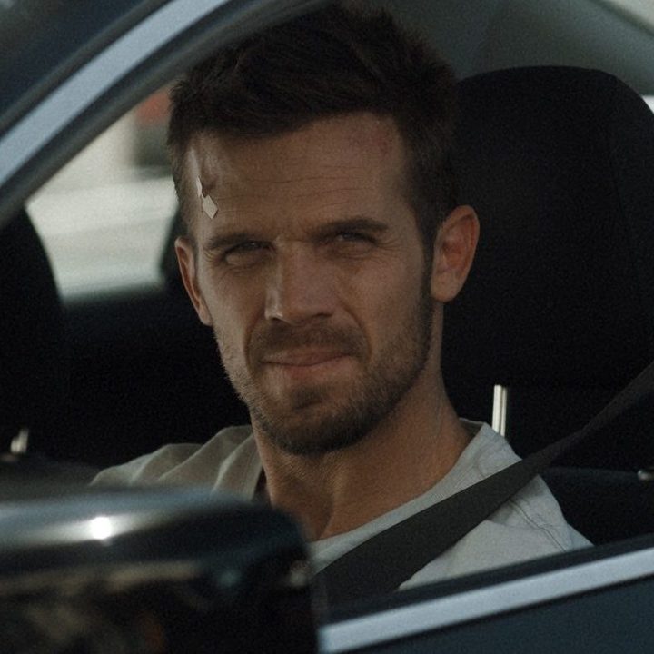 Cam Gigandet sitting in a car in a scene from Blowback.