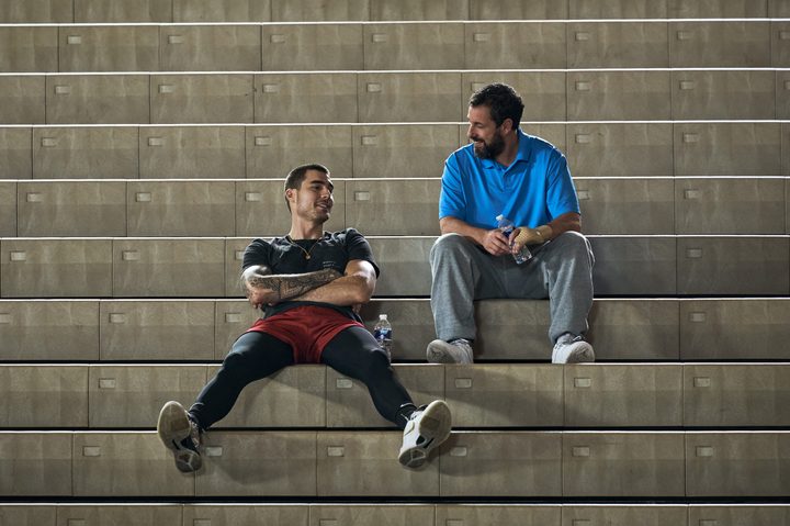 Bo Cruz and Stanley Sugarman sit on bleachers together in Hustle.