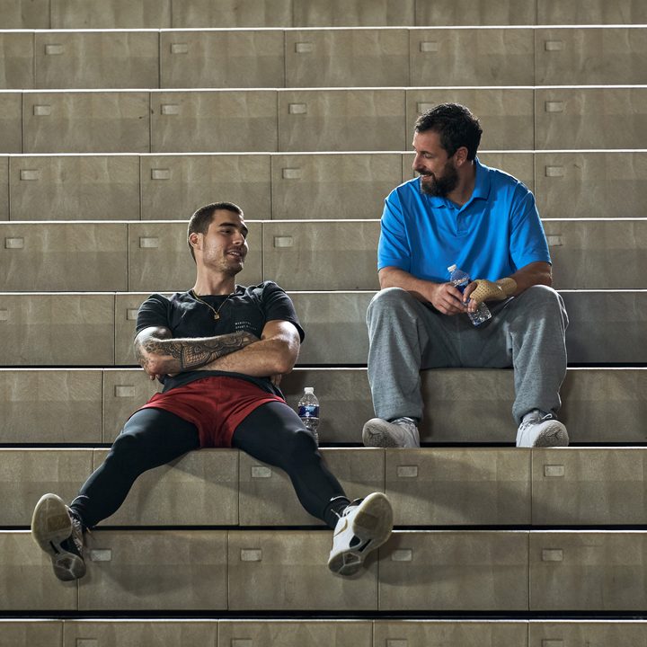 Bo Cruz and Stanley Sugarman sit on bleachers together in Hustle.