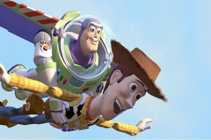 Buzz and Woody are flying in a scene from the Pixar film Toy Story