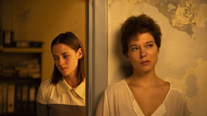 Kristen Stewart stands behind Léa Seydoux in "Crimes of the Future."