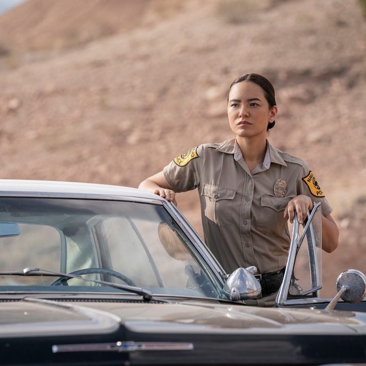 Bernadette Manuelito standing outside her car in a scene from Dark Winds.