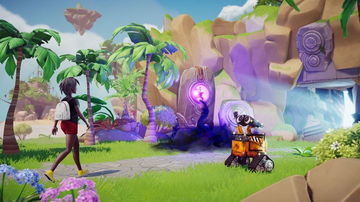 A player walks by Wall-E while heading into a cave in Disney Dreamlight Valley.