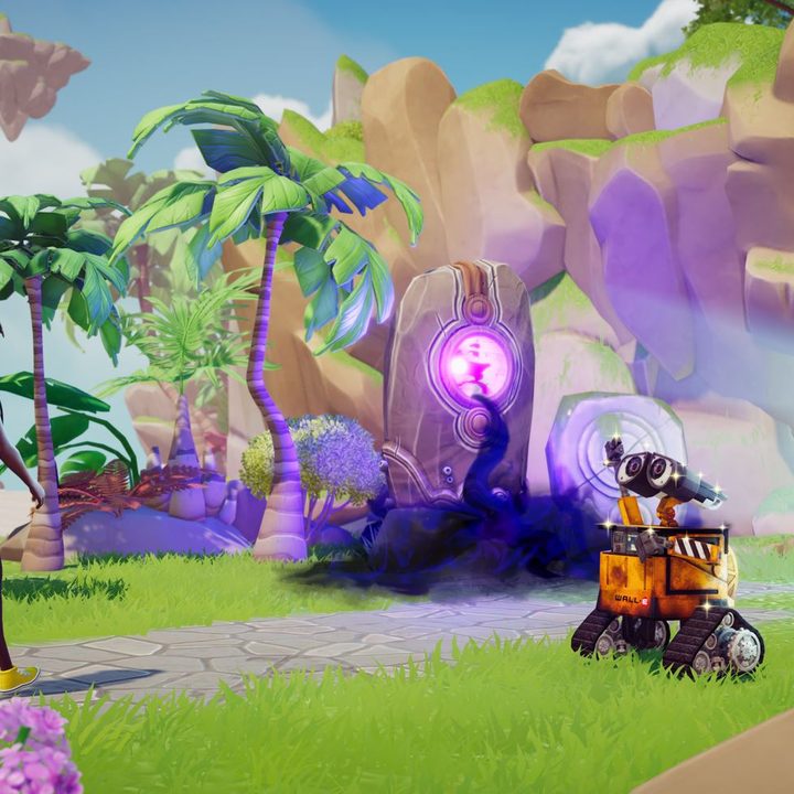 A player walks by Wall-E while heading into a cave in Disney Dreamlight Valley.