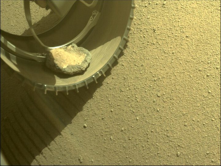 A rock in the front left wheel of Perseverance on Sol 343, image was acquired on Feb. 6, 2022 (Sol 343).