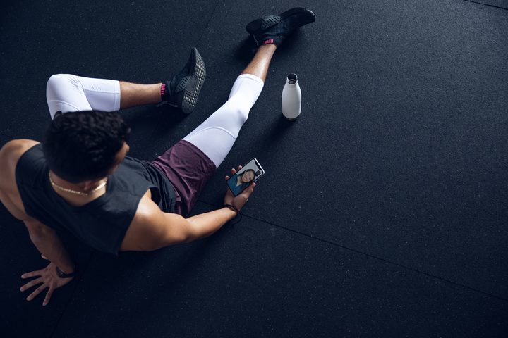 A man using the Future personal training app on a phone.