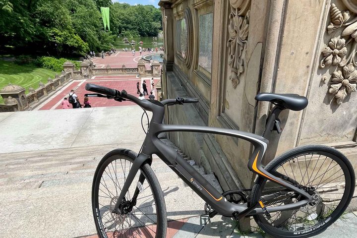 The Urtopia eBike leaning against a wall.