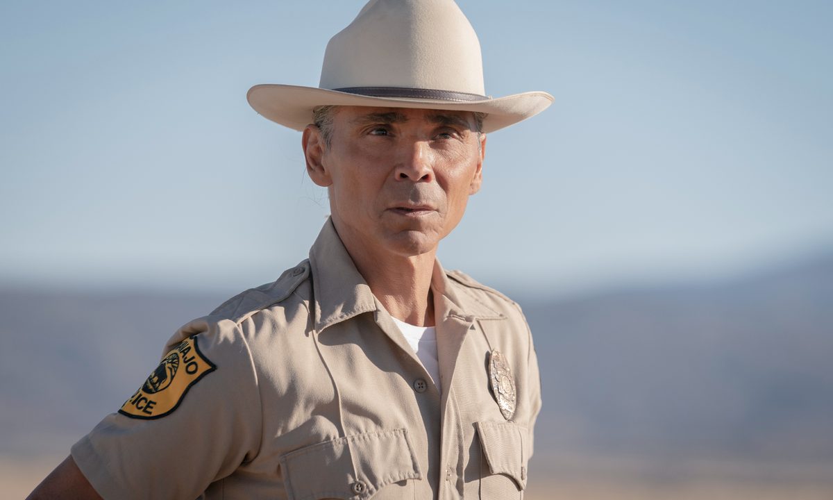 Joe Leaphorn stands in the desert in Dark Winds.