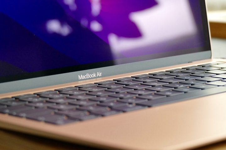 The gold MacBook Air M1's logo and keyboard.