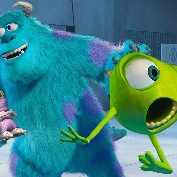 Sulley holds Mike Wazowski and a disguised Boo in a scene from the Pixar film Monsters, Inc.