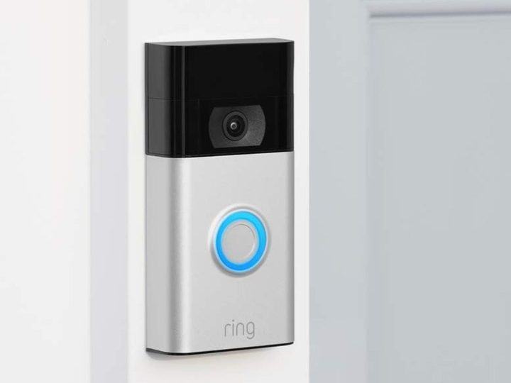 Ring Video Doorbell installed next to a white entry door.