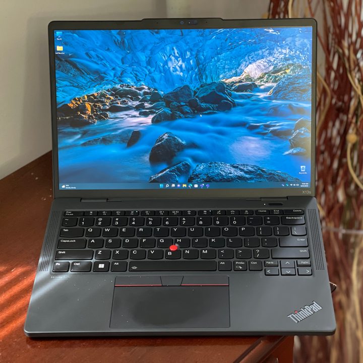 The ThinkPad X13s, open on a table.
