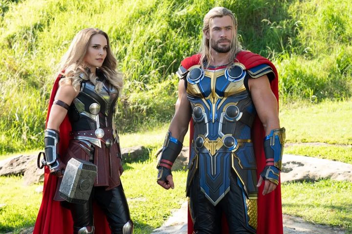 Thor and Jane Foster stare at something out of frame in a scene from the MCU film Thor: Love and Thunder