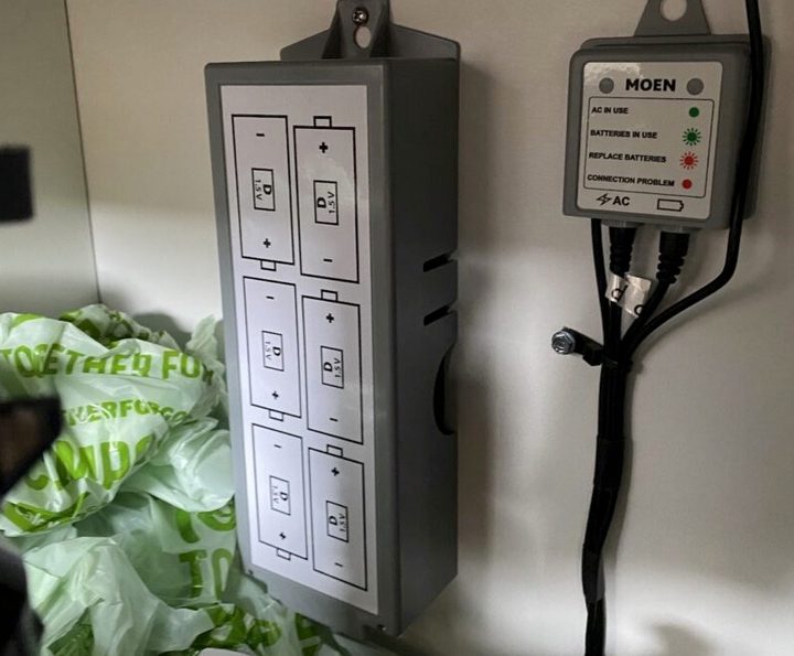 Battery pack and AC power hub attached to U by Moen tap.
