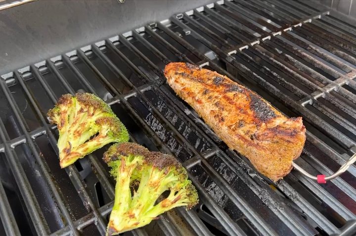 Broccoli and meat on the Weber Genesis Smart Grill.