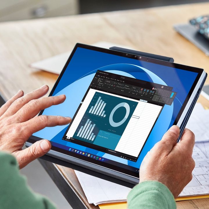 Someone using the touch screen of the XPS 13 2-in-1.