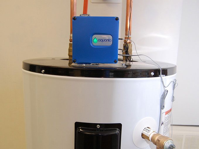 Aquanta hot water controller on top of a water tank.