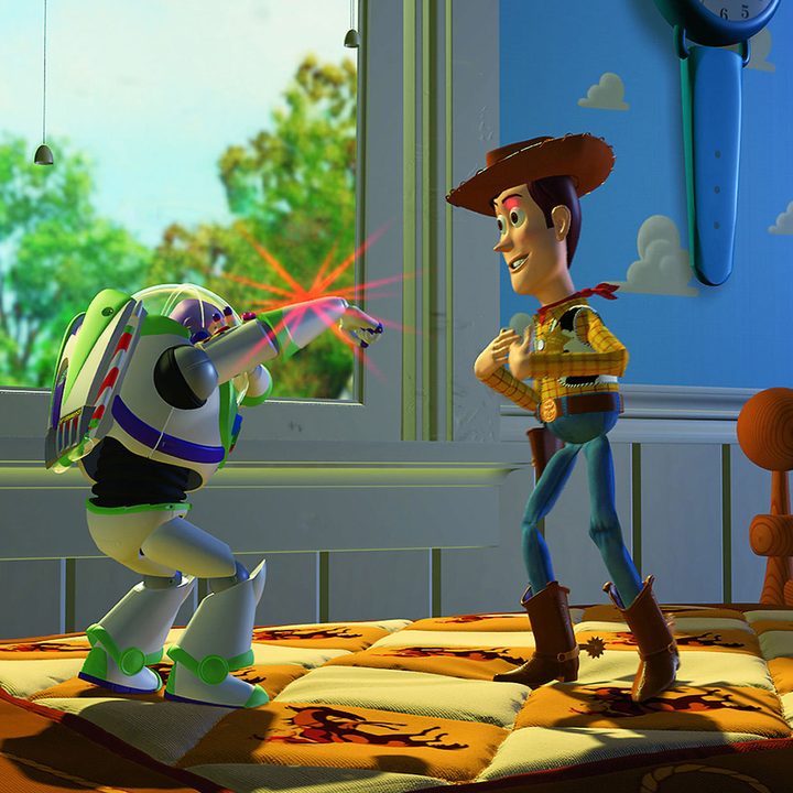 Buzz flashes his wrist laser at Woody in Toy Story (1995)