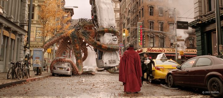 Doctor Strange stands on a street facing the monstrous, tentacled creature Gargantos in a scene from Doctor Strange in the Multiverse of Madness.