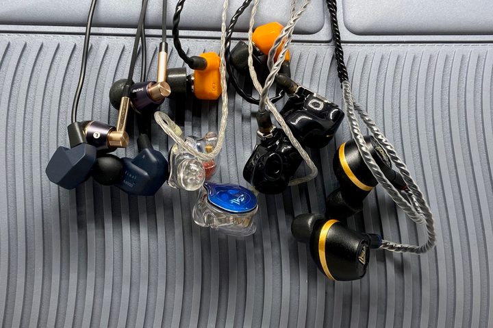 A collection of six models of in-ear monitors.