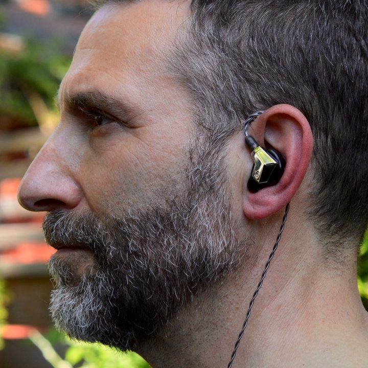 Man wearing the Campfire Audio Supermoon in-ear monitors.