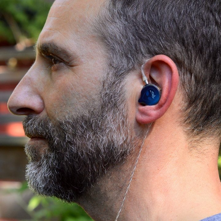 Man wearing the UE 5 Pro in-ear monitors.