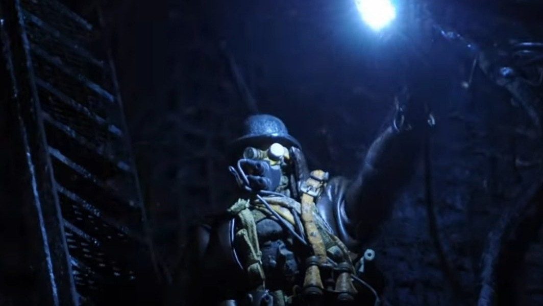 The Assassin lights a flare in a scene from Mad God.