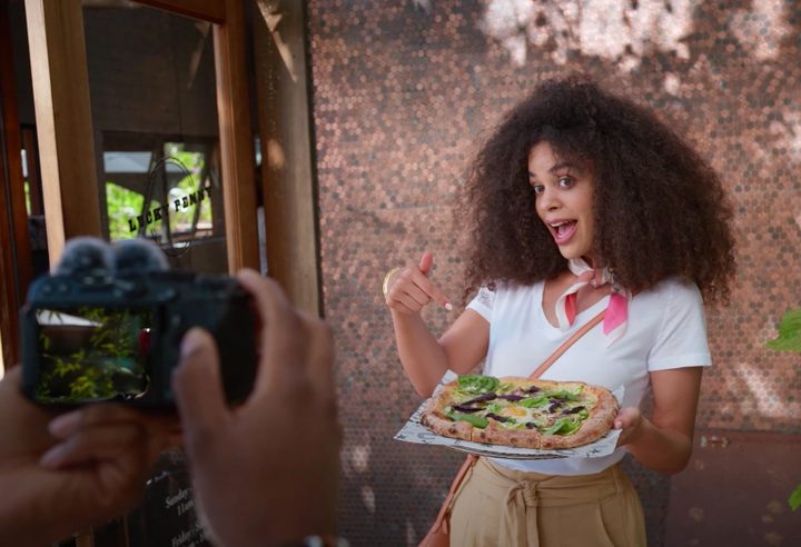 A vlogger using Nikon's Z 30 camera.