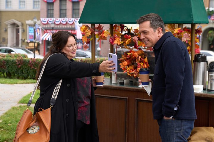 Reagan shows Nathan her phone in Rutherford Falls.
