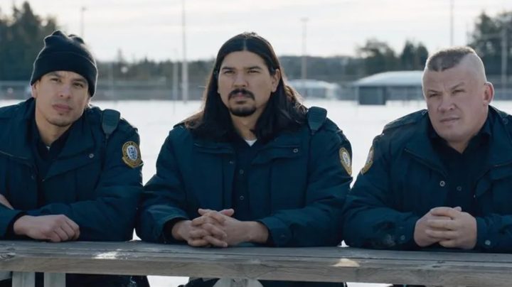 Jordan Nolan, Brandon Nolan, and Jon Mirasty sit at a picnic table in the winter in a scene from Shoresy.