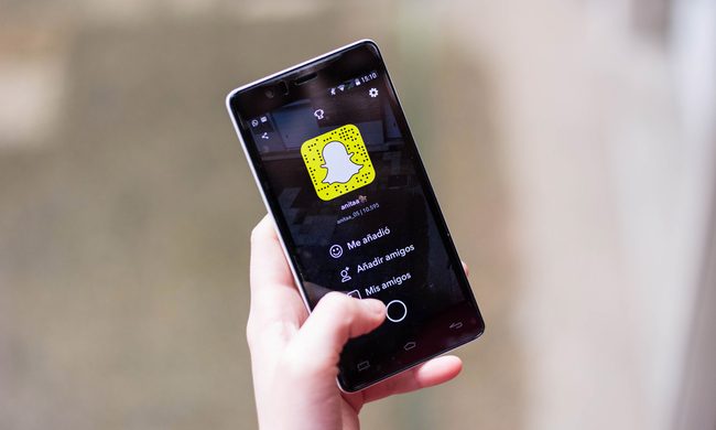 A person using Snapchat on an iPhone.