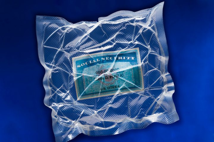 A social security card in shrink-wrap paper.