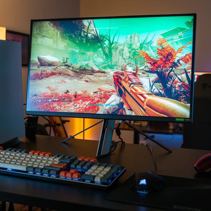The Sony InZone M9 sitting next to a PlayStation 5.