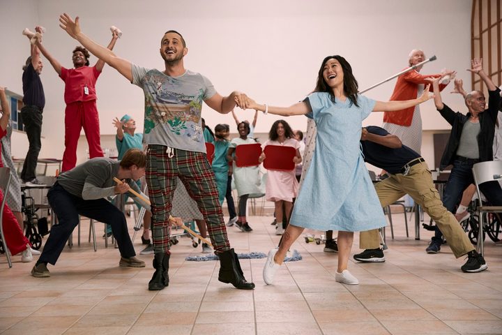 Tomer Capon and Karen Fukuhara dance in a scene from The Boys season 3.