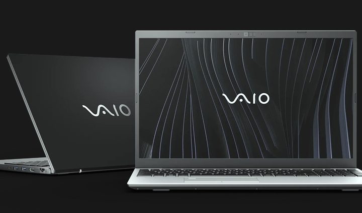 Two Vaio laptops against a black background.