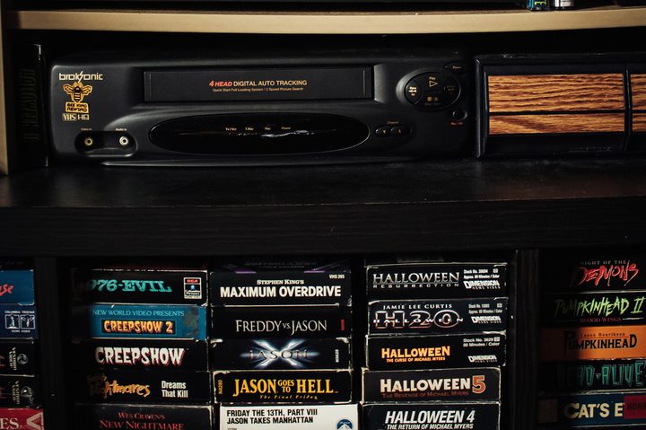 A VCR player and VHS tapes.