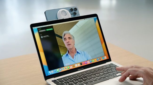 An iPhone being used in a continuity demo with a Mac laptop