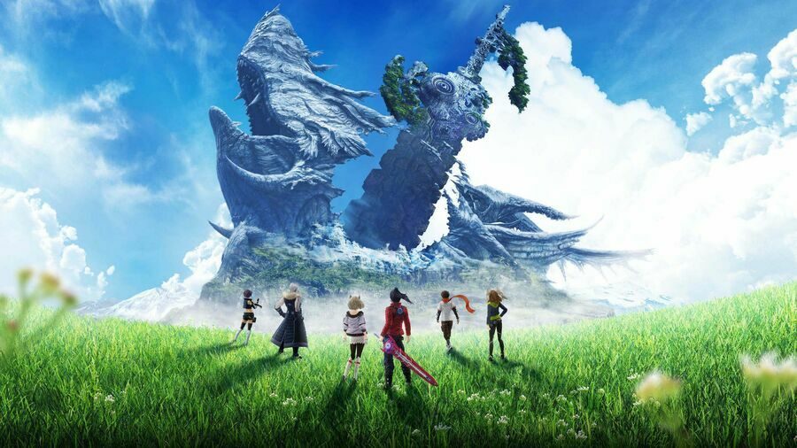 Noah and his team standing in a green field.