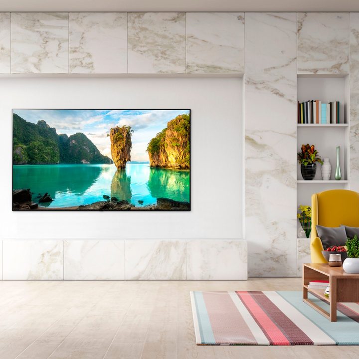 An 83-inch LG C1 OLED TV hangs on a living room wall.