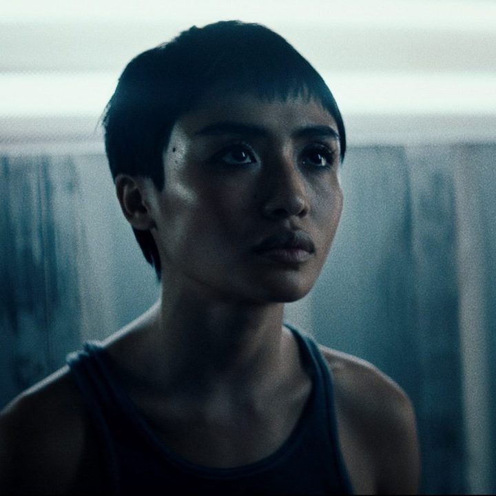 Brianne Tju looking on in a scene from Gone in the Night.
