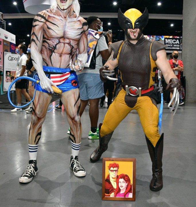 Two cosplayers as Tygra and Wolverine at Comic-Con 2022.