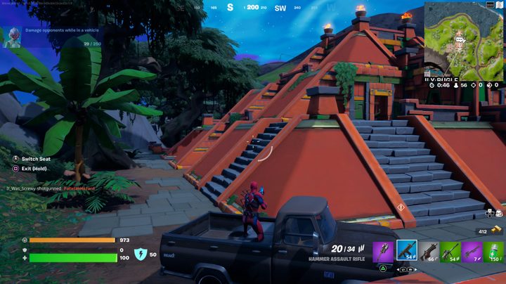 Player shooting out of vehicle at The Temple in Fortnite.