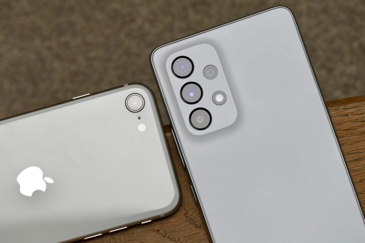 The Galaxy A53 and iPhone SE 2022's camera lenses.
