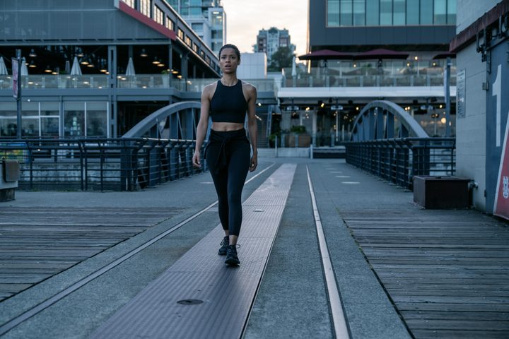 Gugu Mbatha-Raw walks along a pier in Surface.