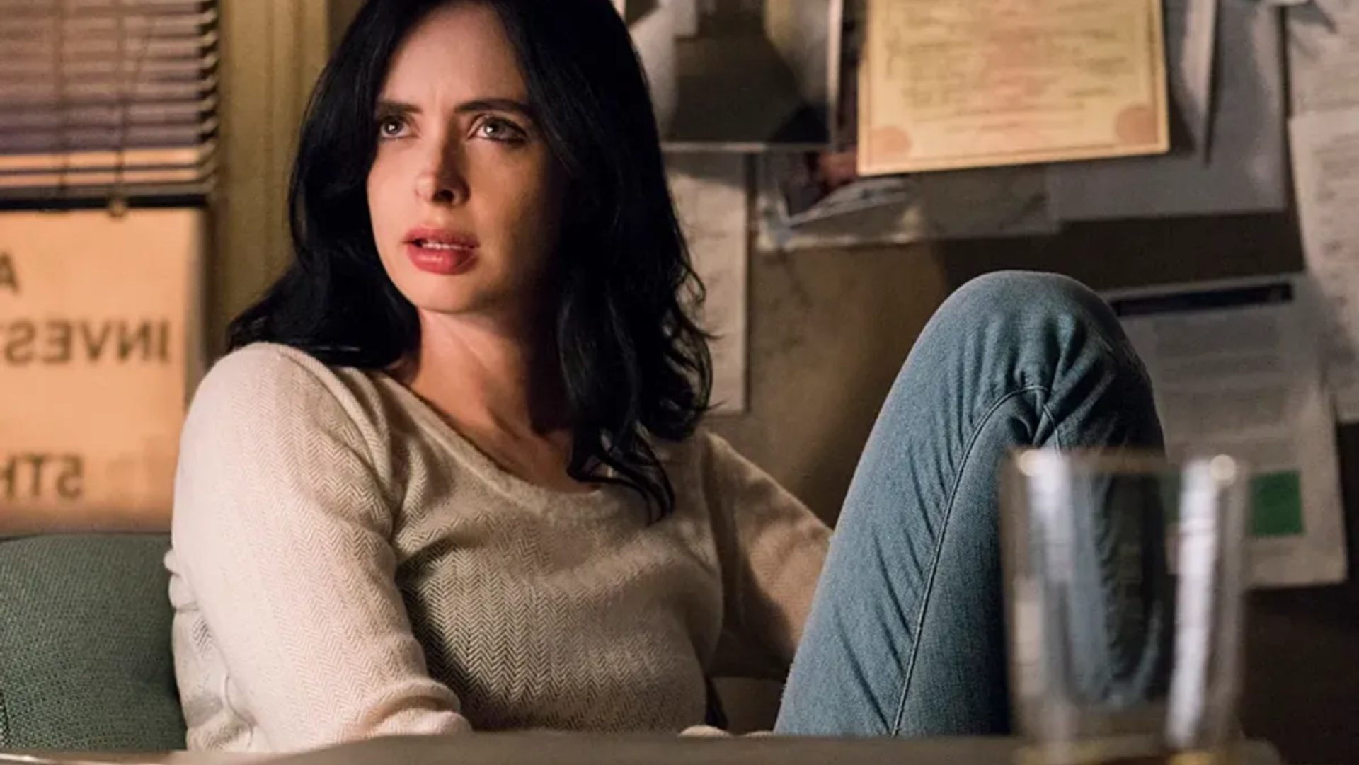 Jessica Jones sitting in her office at Alias Investigations.